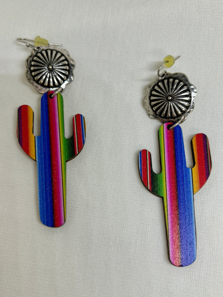Serape catus earrings with silver design above it.