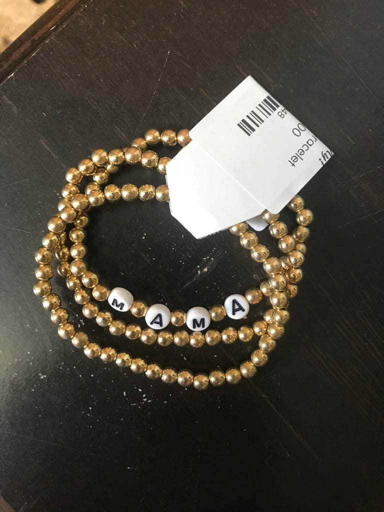 Gold Beaded bracelet with white beads that spell out Mama