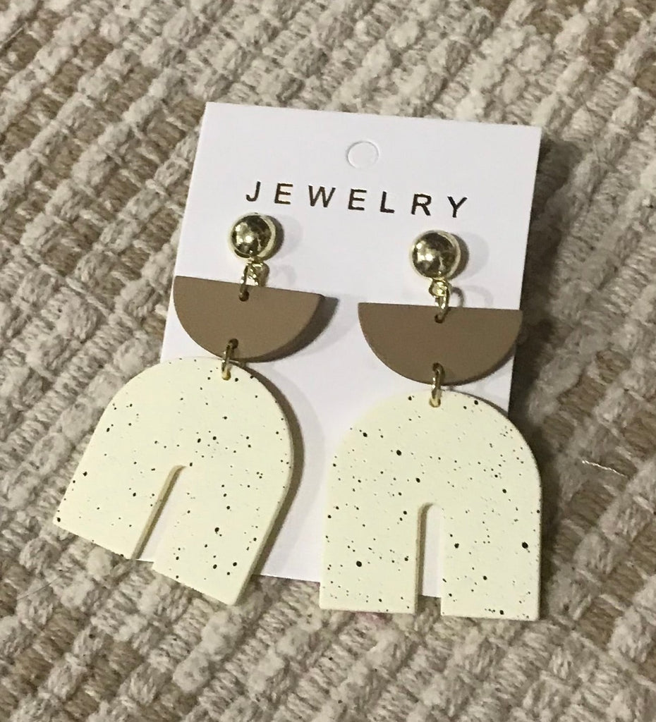 Earrings with tan semicircle and white shape
