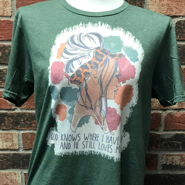 Green short sleeve t shirt with a girl pictured on front. "God knows where I have been and he still love me." written across the bottom.