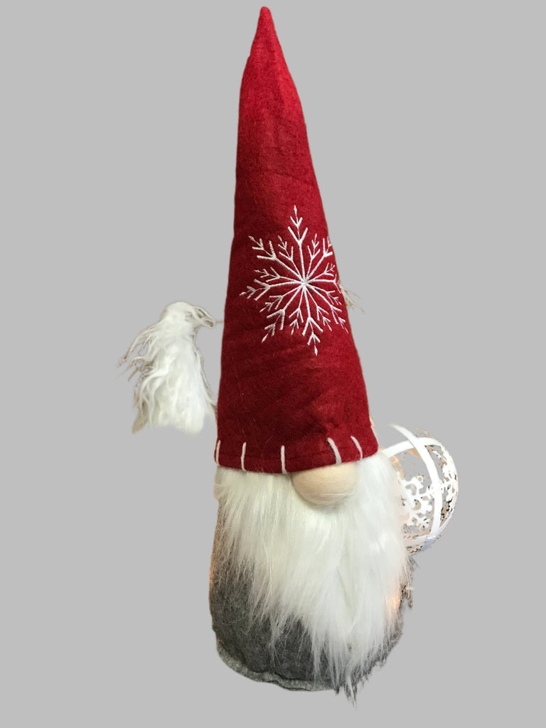 Christmas Gnome with a long white beard and a big red hat with a white snowflake on it