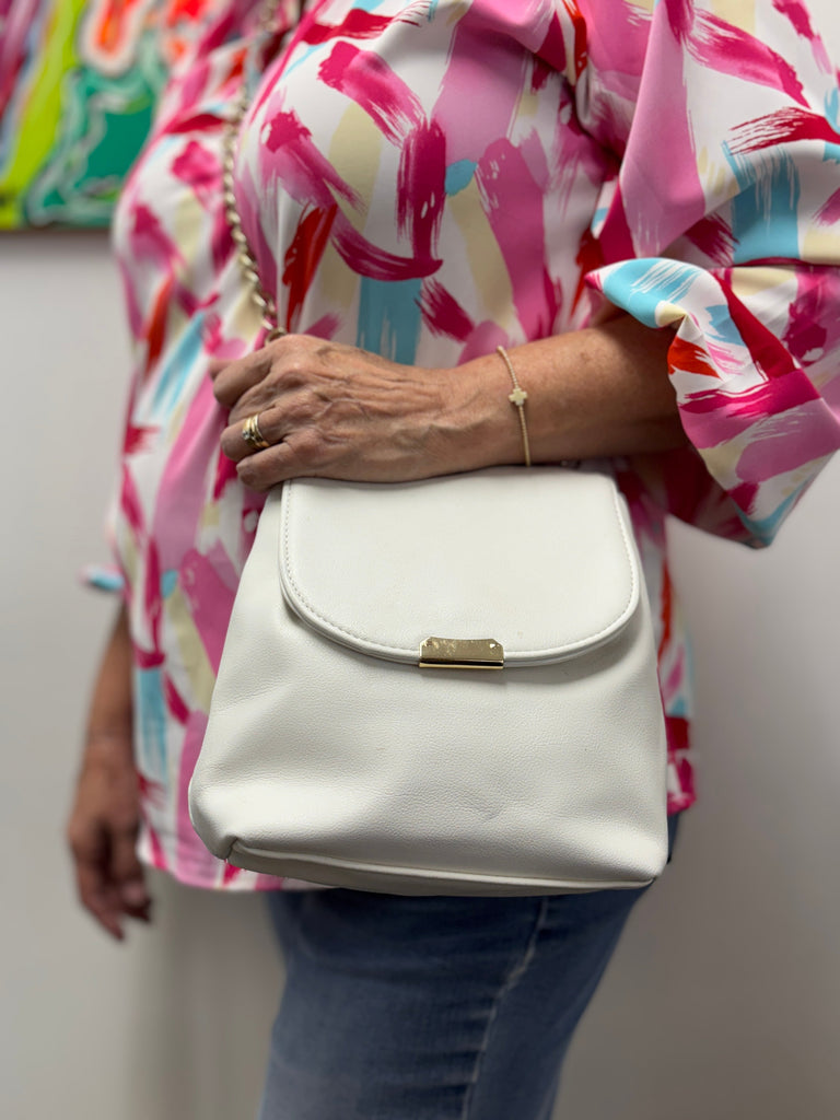 Why Every Woman Over 40 Needs This Chic  White Crossbody in Her Wardrobe