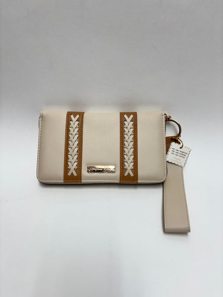A neutral beige and tan crossbody wristlet with whipstitch accents and gold-tone hardware, photographed on a clean white background