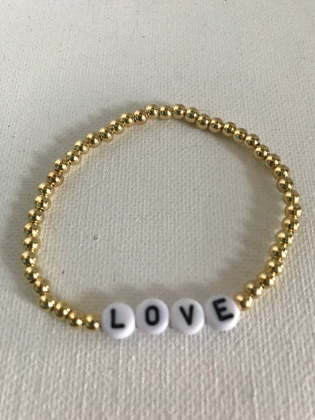 Stretch Bracelets-gold beads w/white back letter LOVE