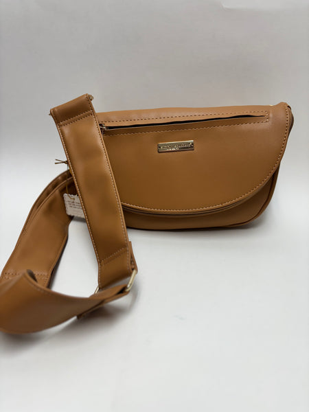 A stylish tan colored faux leather crossbody bag with a wide adjustable strap and gold nameplate on a clean white background.