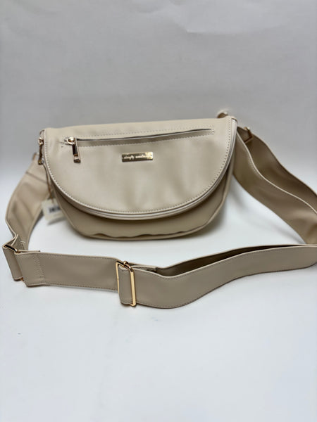 A stylish cream colored faux leather crossbody bag with a wide adjustable strap and gold nameplate on a clean white background.