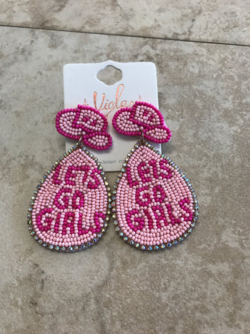 Beaded earrings with pink cowboy hats and below it says "Lets go girls"