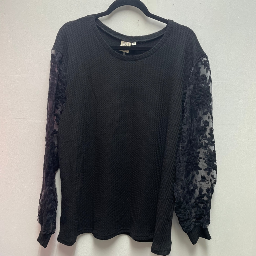 Grace & Emma black long sleeve top with sheer floral sleeves. Elegant blouse