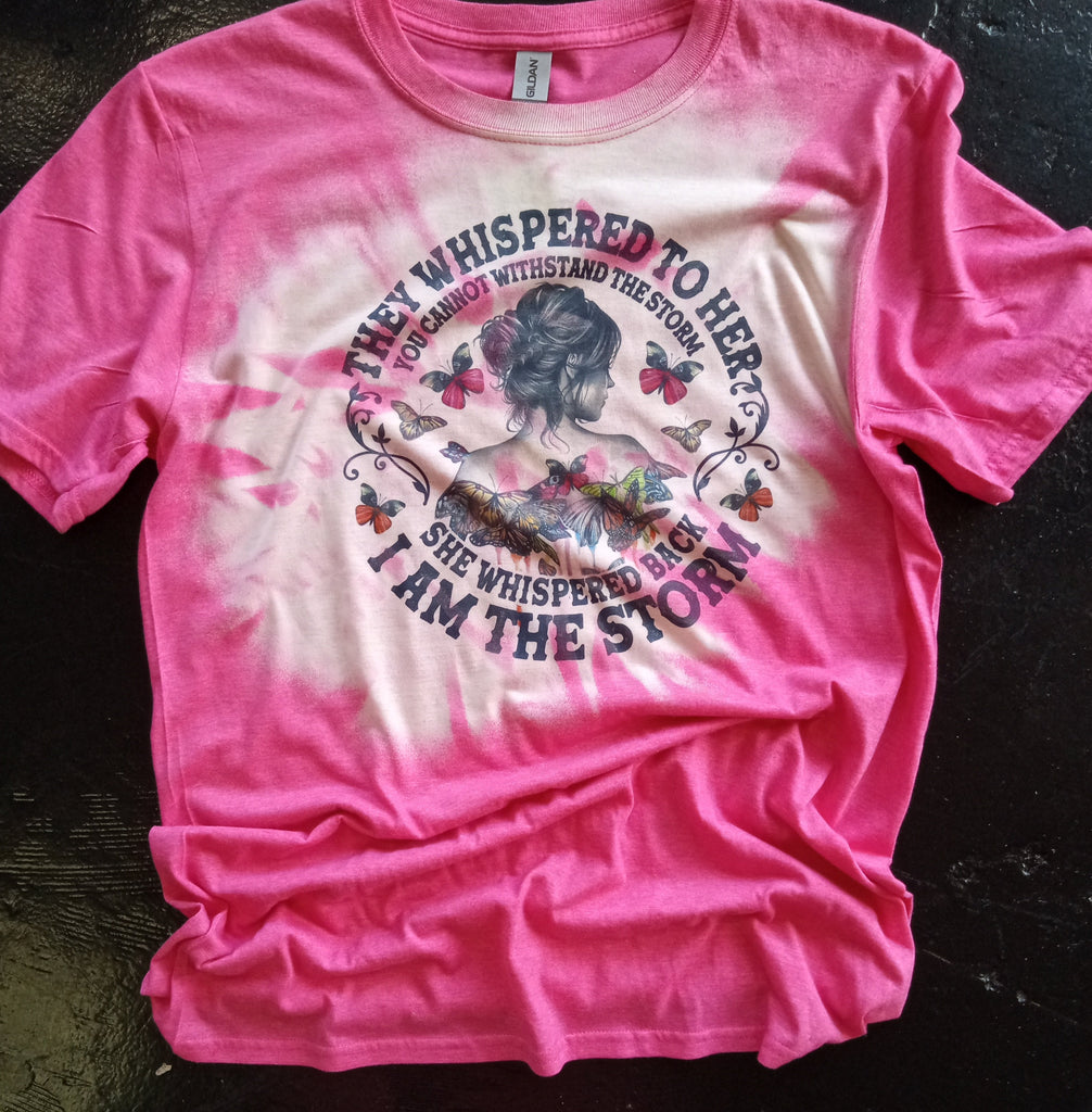 Bleached Hot Pink Shirt with A Woman, Butterflies, And " They Whispered To Her You Cannot Withstand The Storm She Whispered Back I Am The Storm" Printed on The Front