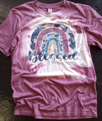 Maroon Bleached tshirt that has a rainbow over the word blessed 