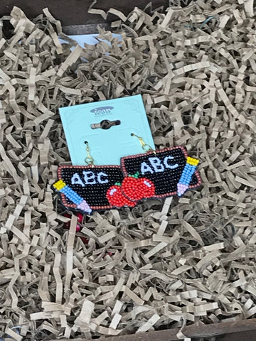 Beaded earrings that have a pencil, apple, and "ABC" on a chalk board.