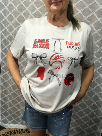 Cream colored t-shirt with and eagle in the middle and florence saying with gray bows.