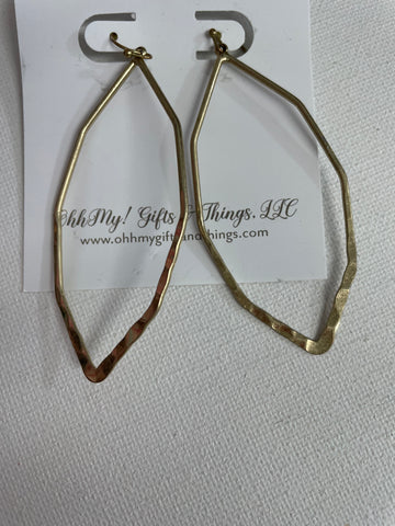 A pair of hammered gold abstract hoop earrings displayed on an OhhMy! Gifts and Things, LLC branded card, with a textured white background