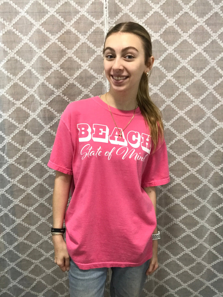 Hot pink short sleeve shirt with the words "Beach state of mind" along the front