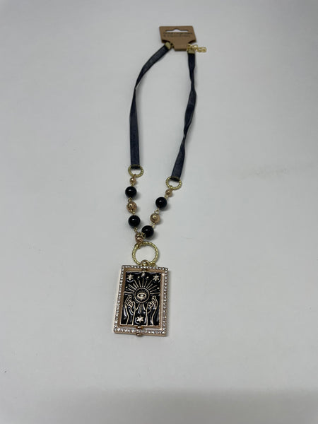 Designer Necklaces Stephanie Lewis-Gold Lava Stone square with reaching hands trimmed in rhinestone