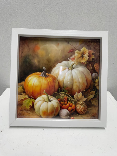 Framed artwork of pumpkins and autumn elements on a gray background