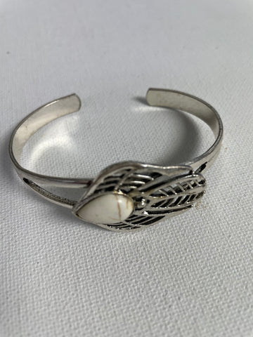 Silver Aztec bracelet w/small white teardrop stone