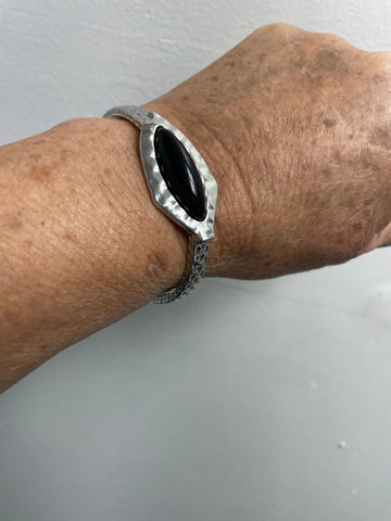 Silver stretch arrowhead with black oblong oval stone bracelet