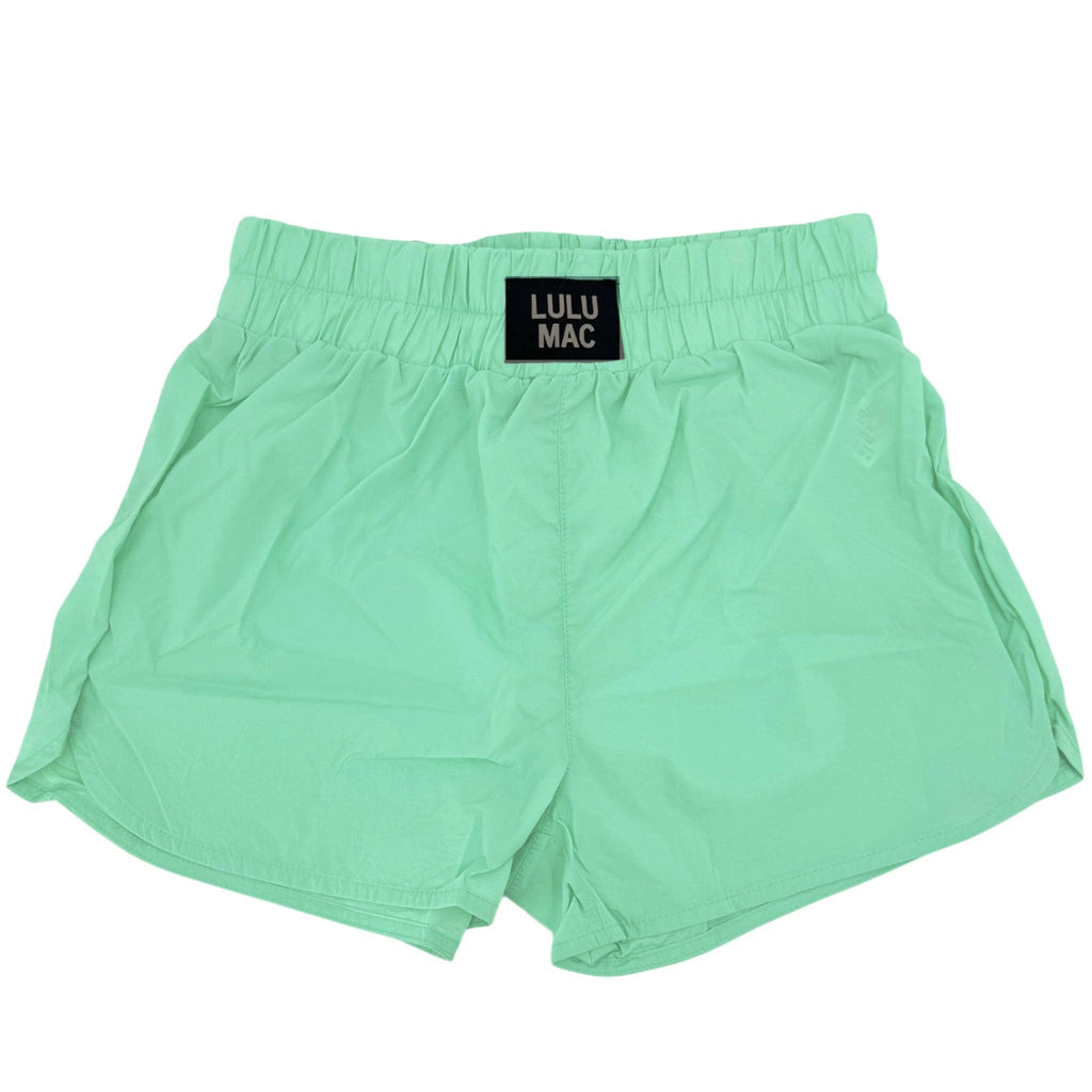Mint green shorts with ulu Mac logo on white background