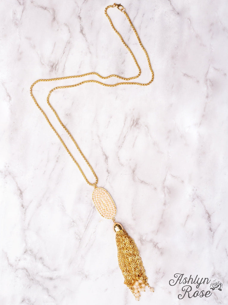 A LITTLE SPARKLE WHITE CRYSTAL OVAL PENDANT TASSEL ON A GOLD NECKLACE Grace+Emma
