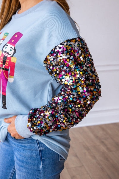 Nutcrackers on Blue Sweatshirt with Sequin Sleeves Grace+Emma