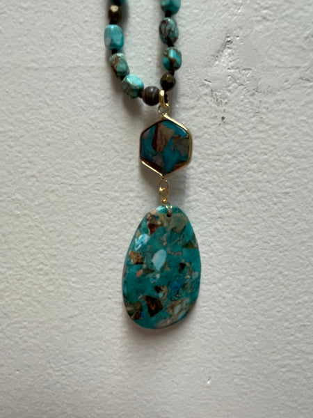 Aqua beaded necklace with a large teardrop pendant 