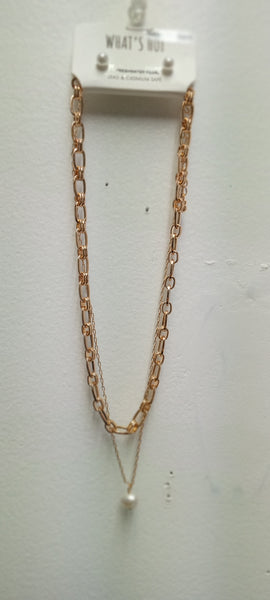 A rose gold double-strand necklace with a small white pearl pendant w/faux pearl stud earrings