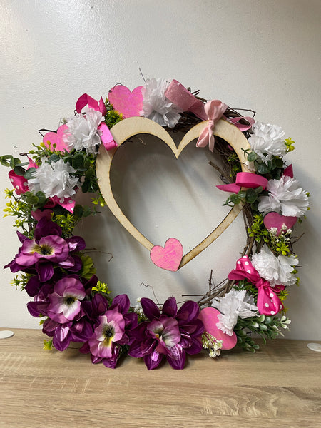 Beautiful 17x17 handmade Valentine wreath perfect for door decor. Features romantic heart accents & premium craftsmanship. Ready to hang Valentine's Day decoration.