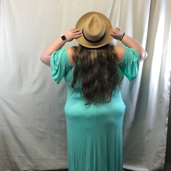 This dress a mint color and it is like a tank but then has the flowing open sleeves. This dress also has pocket on both sides.