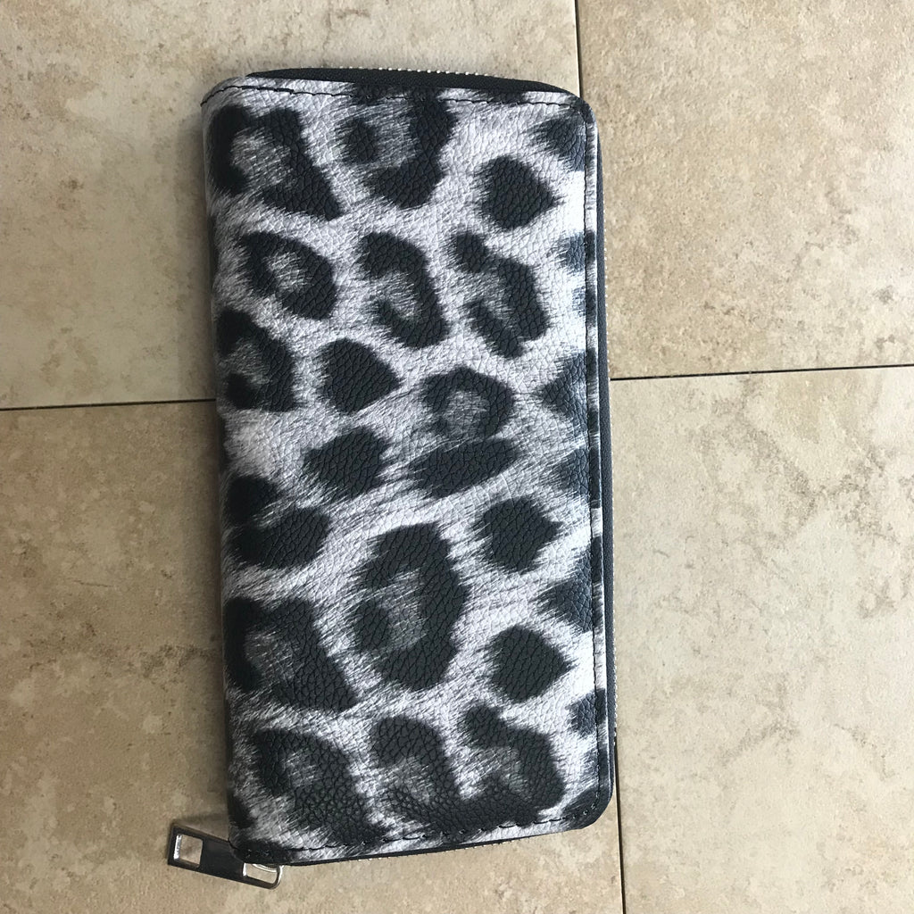 Cheeta black and white animal print wallet with zip closure. 