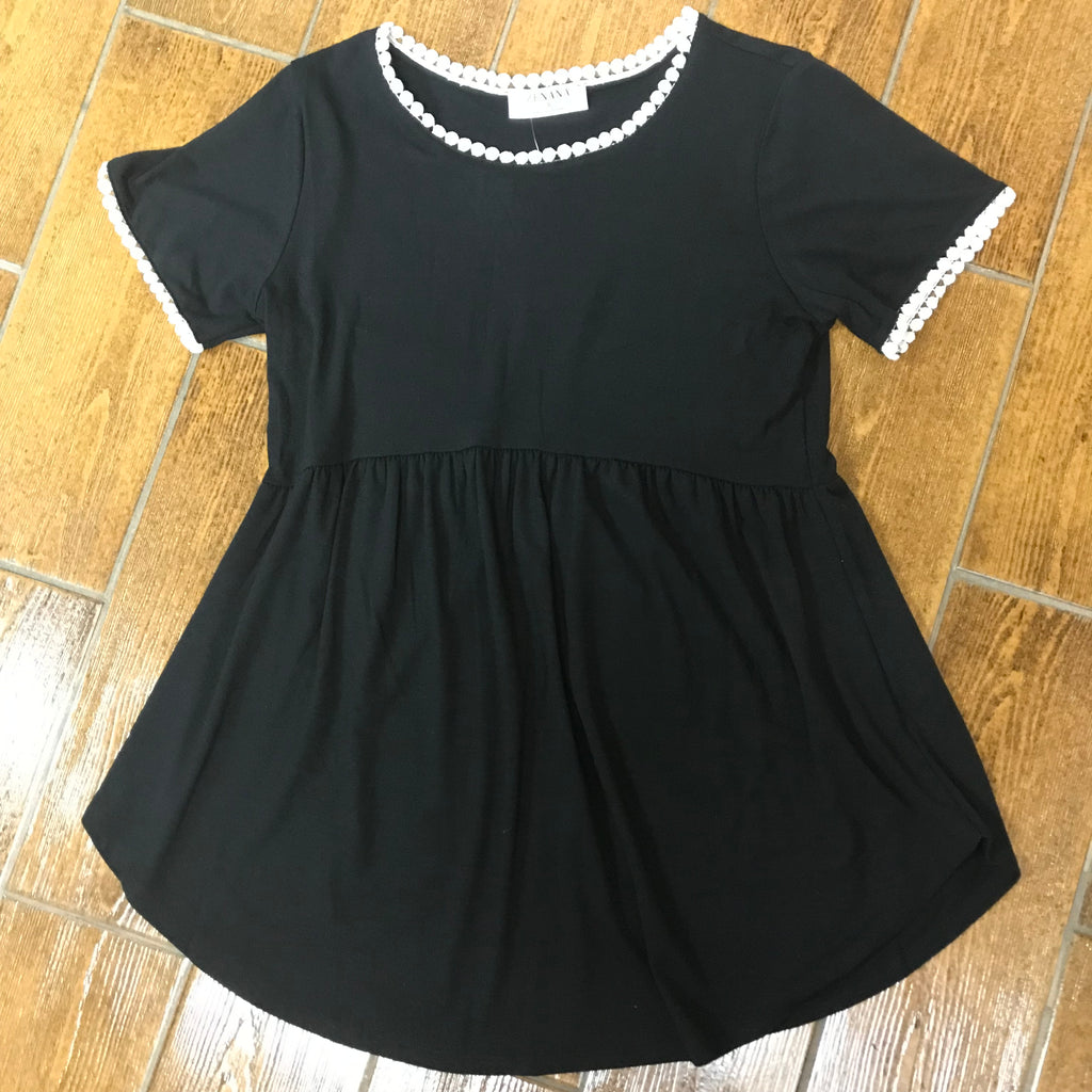 Cute black baby doll style top with white pom trimming on arms and neck.