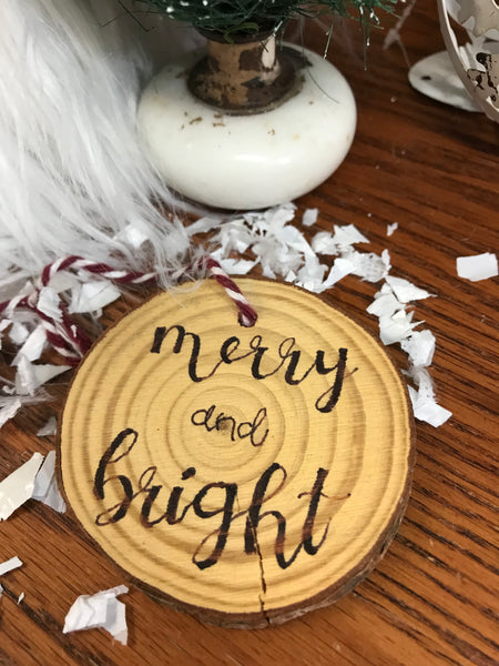 wood ornament with Merry and Bright burned into it