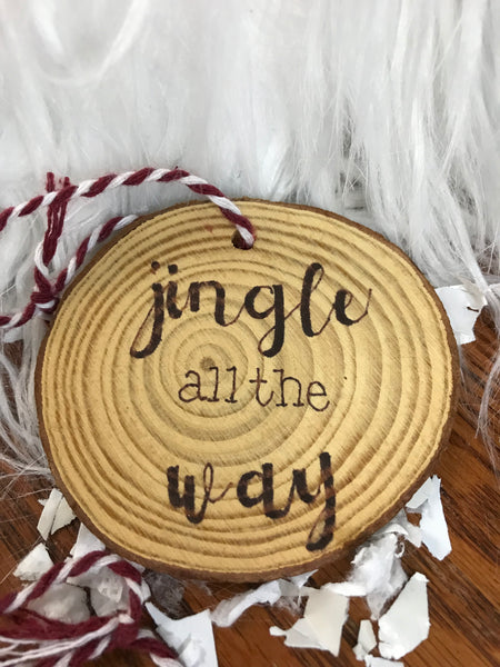 wood ornament with jingle all the way burned into it