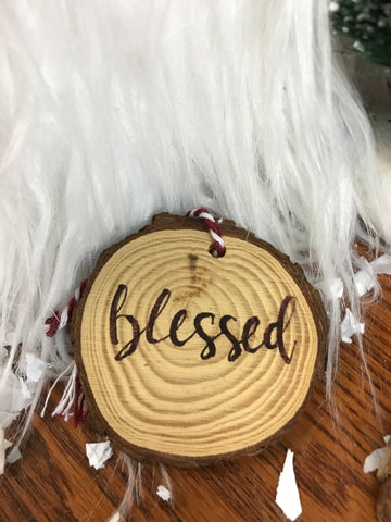 wood ornament with blessed burned into it