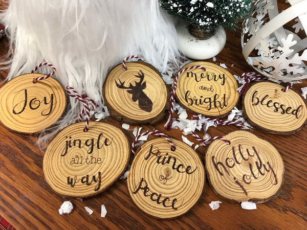 wood ornament with words burned into them
