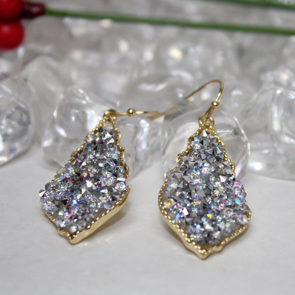 Shimmery diamond earrings that make your outfit shine.