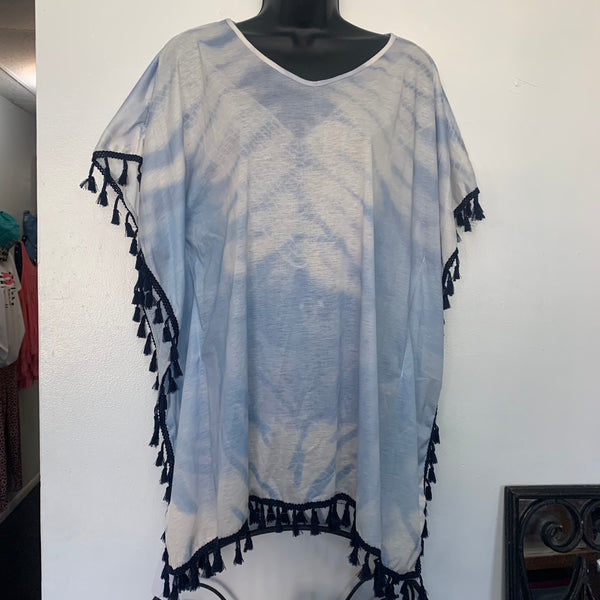 Light blue tie dye swimsuit coverup with navy dangle fringe throughout coverup.