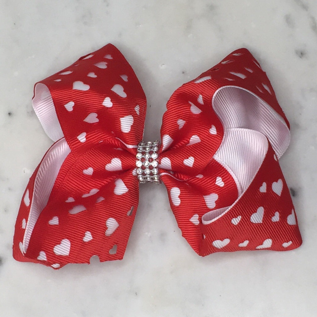 Valentine's Day hair bows for girls with red white hearts. Cute hair clips and accessories perfect for toddlers and kids. Adorable Valentine gift idea.