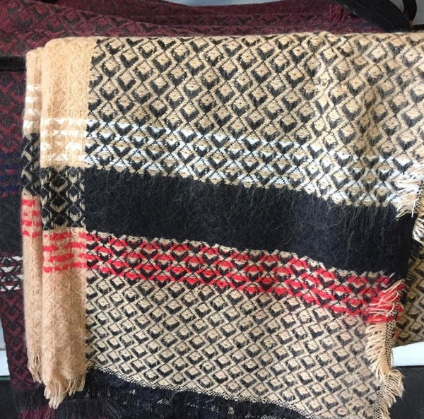 Blanket Scarf. Colors consist of brown with black and red designs.