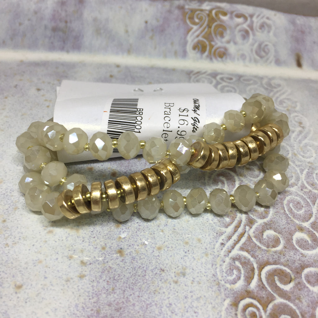 Bracelet set: Elastic. White beads with gold bead in between each white bead and a row of gold disk beads. 