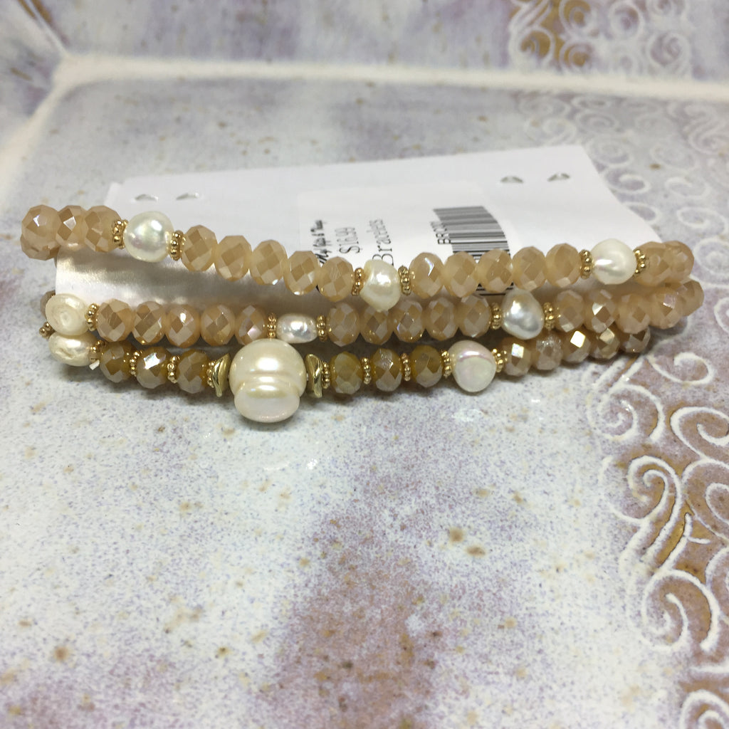 Bracelet set: Elastic. Rose gold beads with pearl beads and occasional gold beads. 