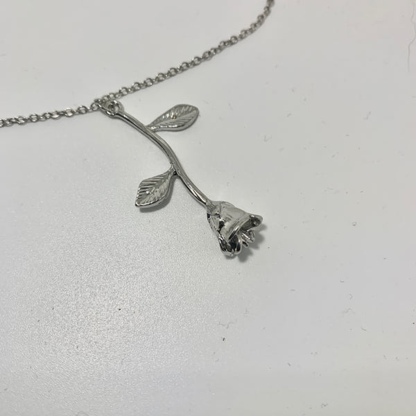 Silver necklace with extender and silver rose pendent.